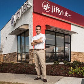 Jiffy Lube franchisee in front of store